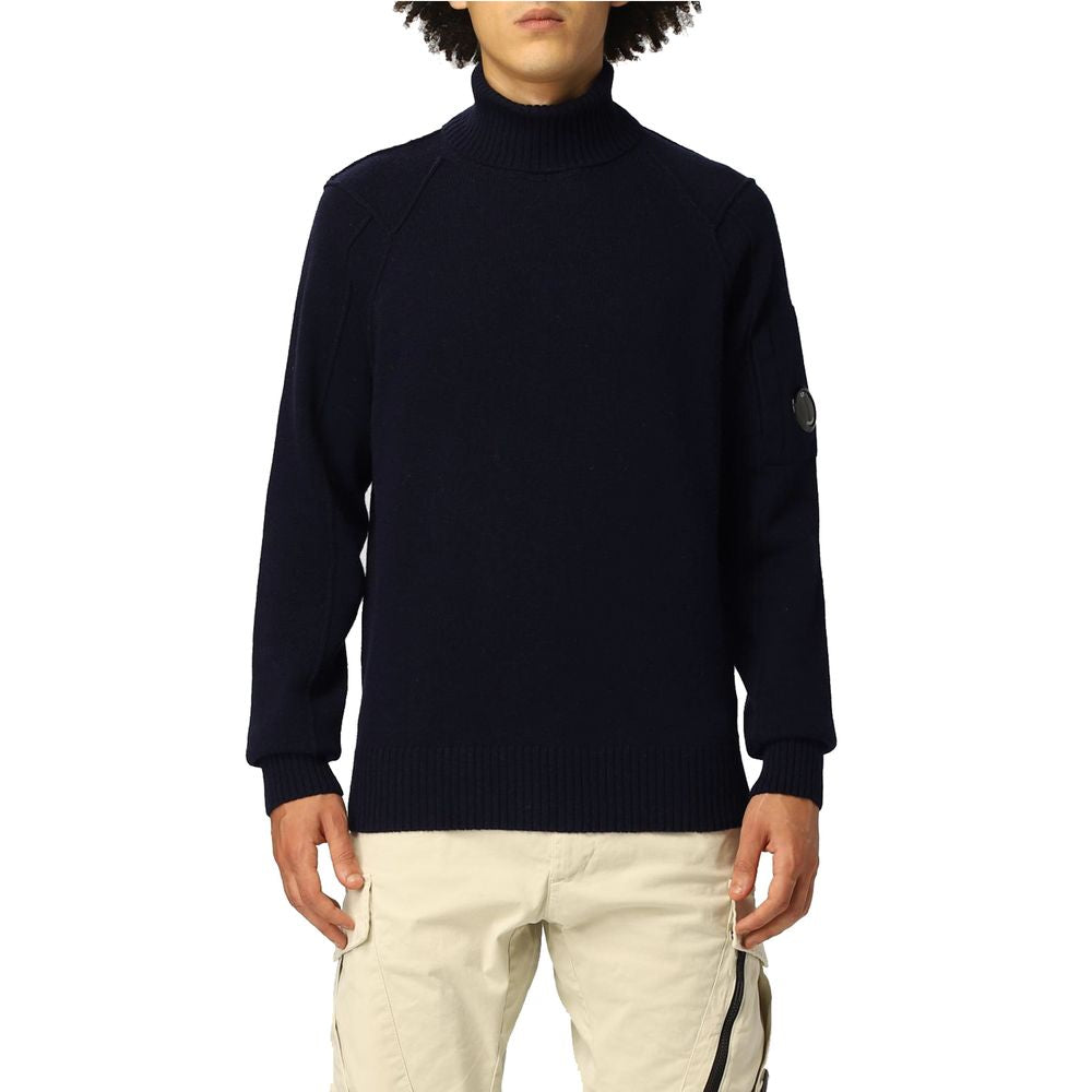 C.P. Company Blue Wool Sweater with ribbed turtleneck and logo plaque, modeled by person in beige pants