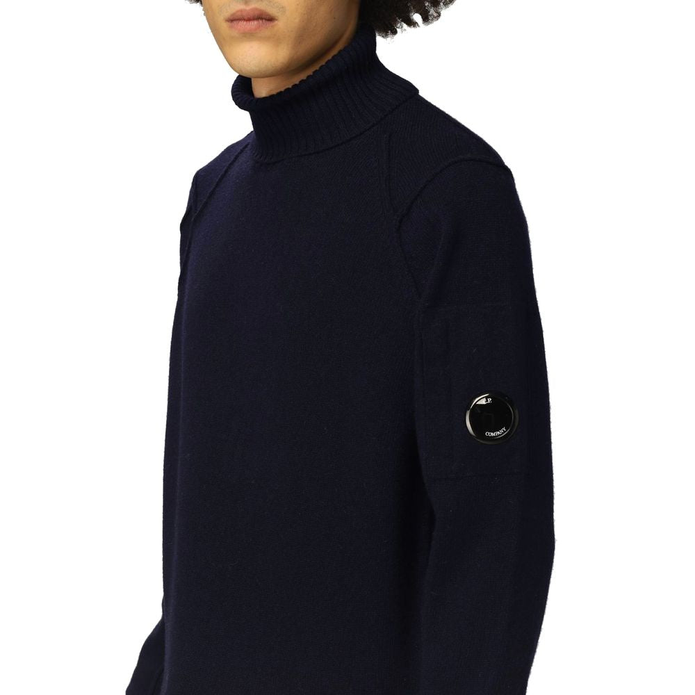 C.P. Company Blue Wool Sweater with ribbed turtleneck, cuffs, hem, and logo plaque on shoulder.