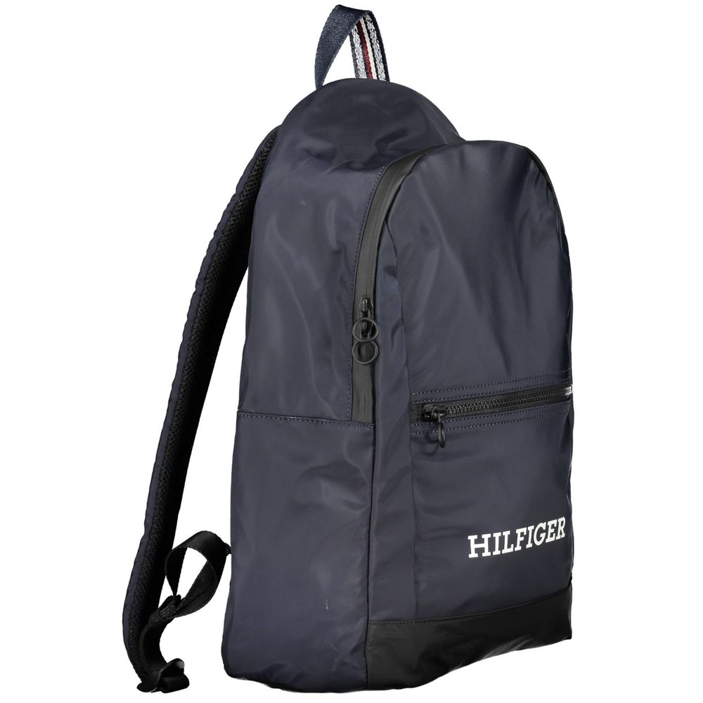 Tommy Hilfiger Blue Polyester Backpack with adjustable shoulder straps, external pockets, internal laptop compartment, and contrasting details.