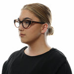 Woman wearing Marciano by Guess Brown Women Glasses Frame in cat eye style.