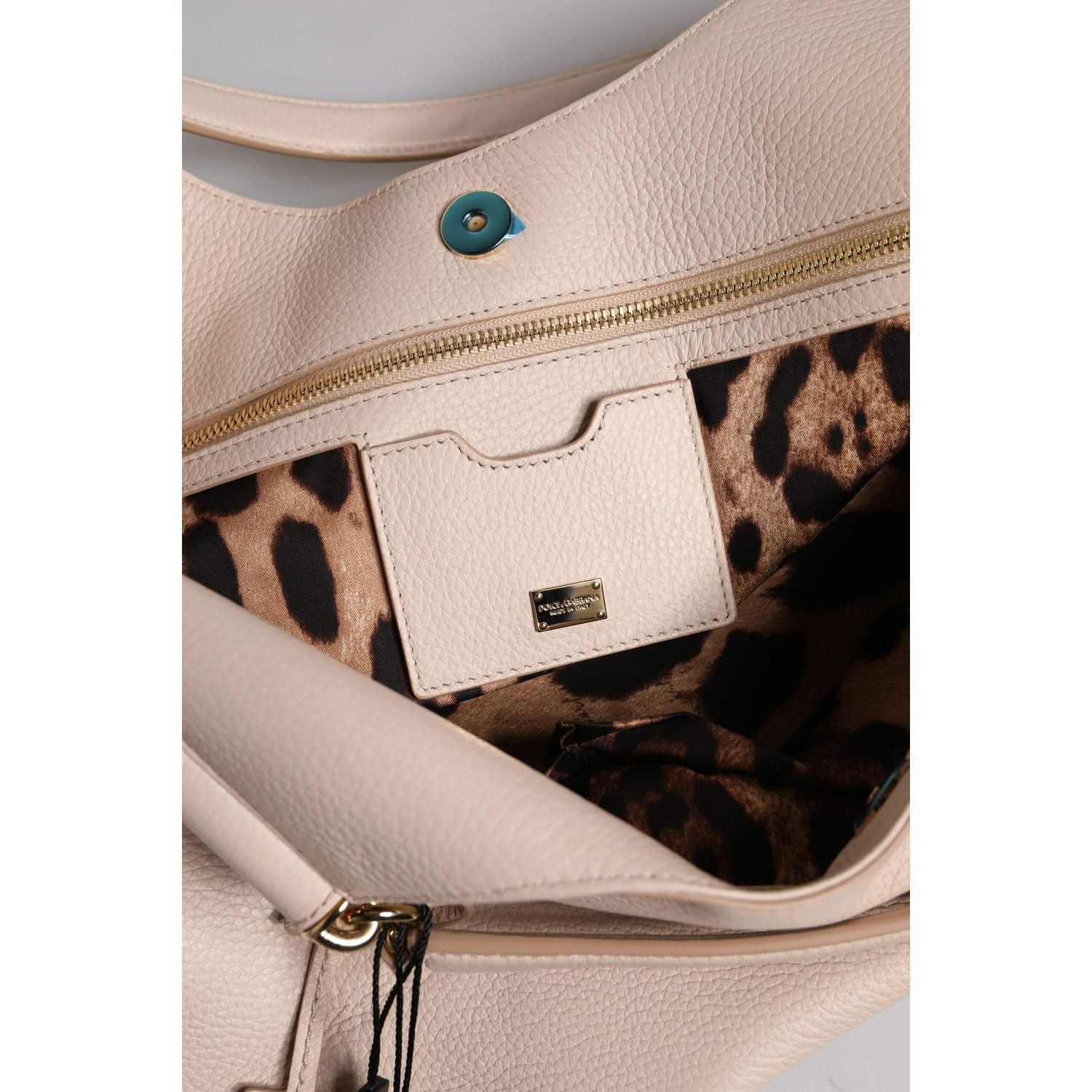 Front view with bag zipped and handles upright.