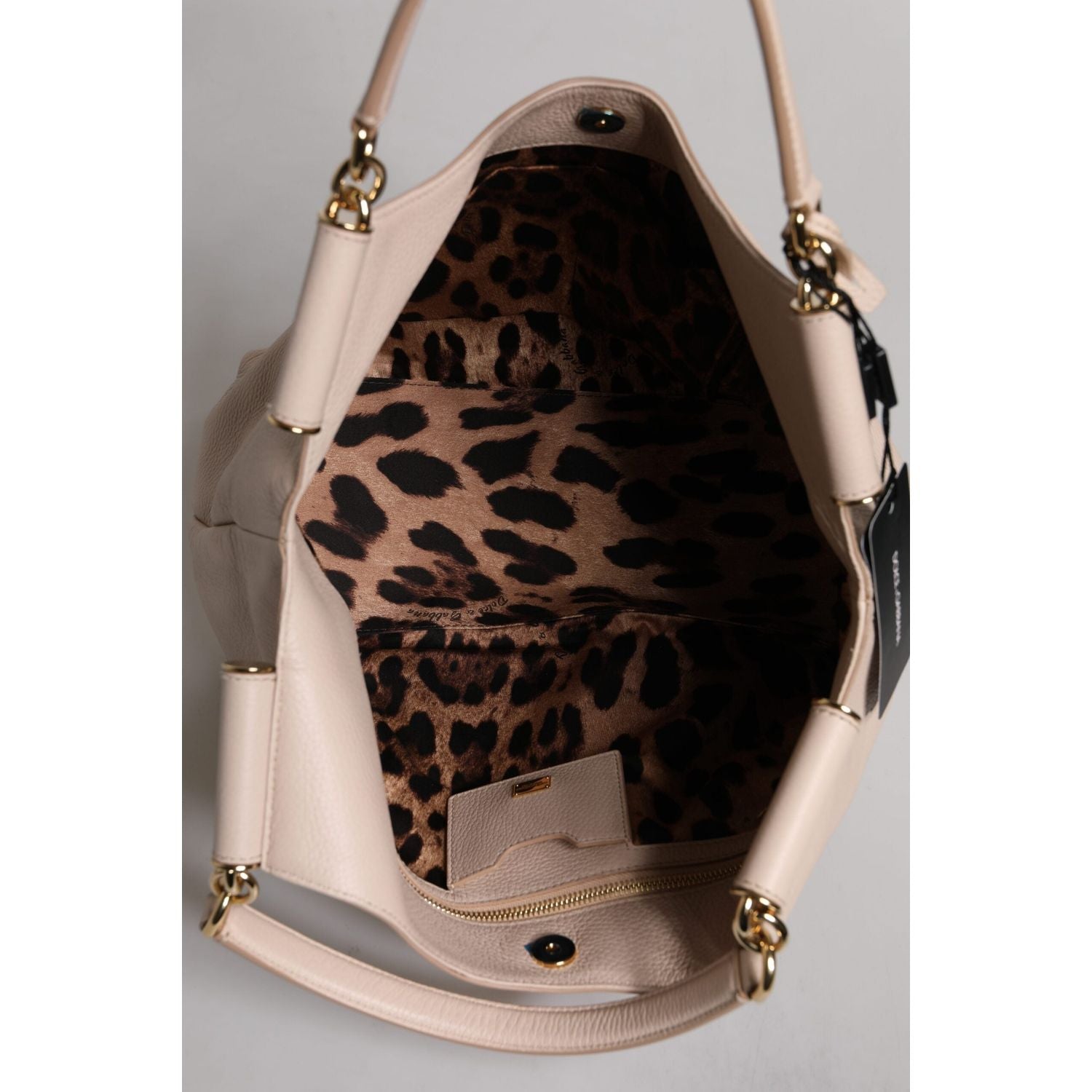 Front view with bag zipped and handles upright.