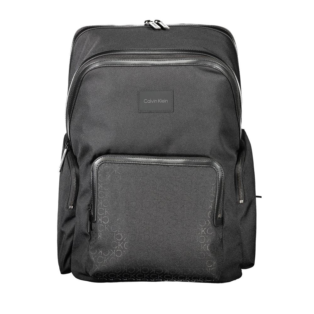 Calvin Klein Black Polyester Backpack with adjustable straps, laptop compartment, external pockets, zip closure, and logo detailing.