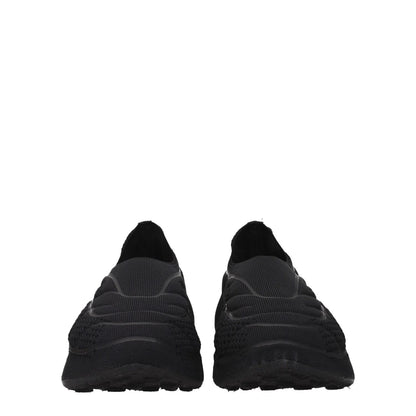 Givenchy Black Fabric Slip-On Loafers with side logo, round toe, mid heels, casual style, and fabric sole, front view.