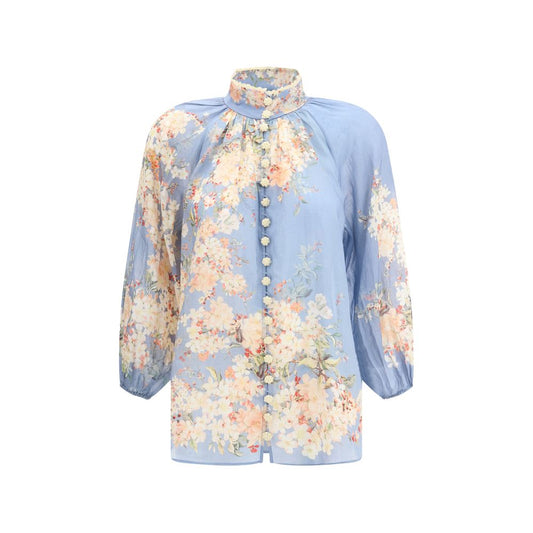 Zimmermann Light Blue Ramie Blouse with puff sleeves, button details, and a floral print, perfect for a romantic style statement.