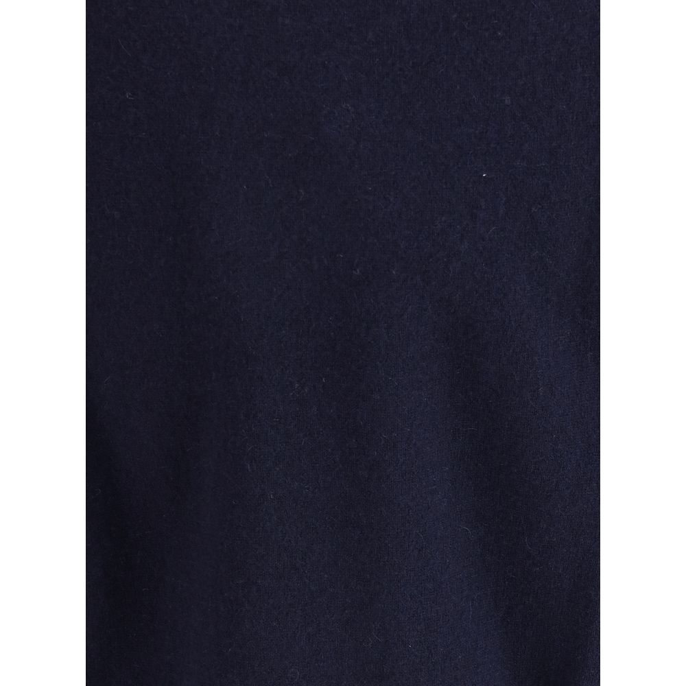 Extreme Cashmere Blue Cashmere Cashmere Sweater featuring a smooth dark blue texture.