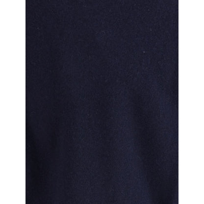 Extreme Cashmere Blue Cashmere Cashmere Sweater featuring a smooth dark blue texture.