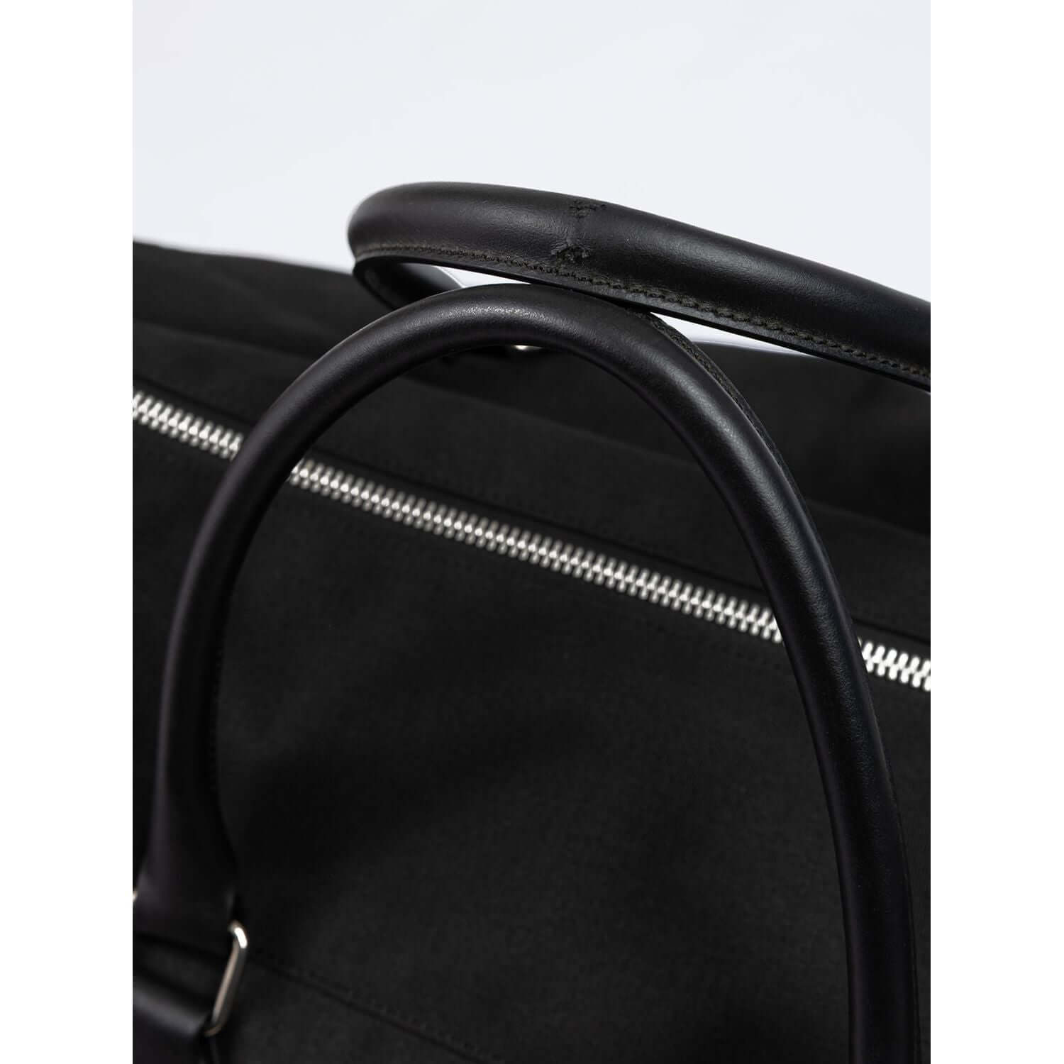 Front view with bag zipped and handles upright.