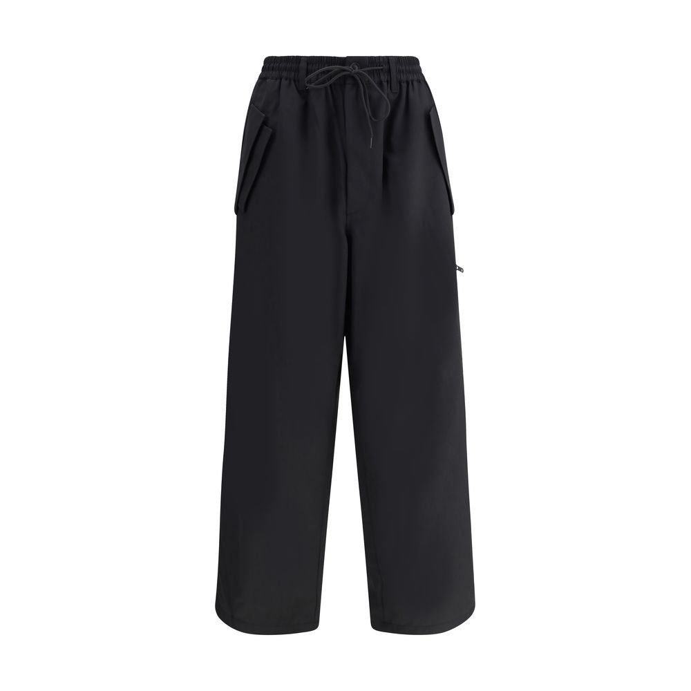 Y-3 Black Wool Casual Pants with adjustable waistband, zipper, button closure, and unique asymmetrical hem design.