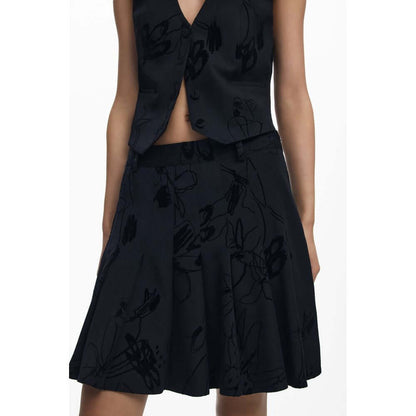 Desigual Black Polyester Women Skirt with bold flock design and side zipper, showcasing daring fashion sense and iconic logo.