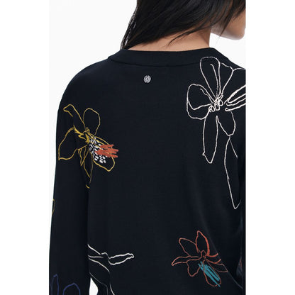 Close-up of Desigual Black Viscose Women Sweater with colorful floral patterns and logo detail, showcasing art-inspired design.