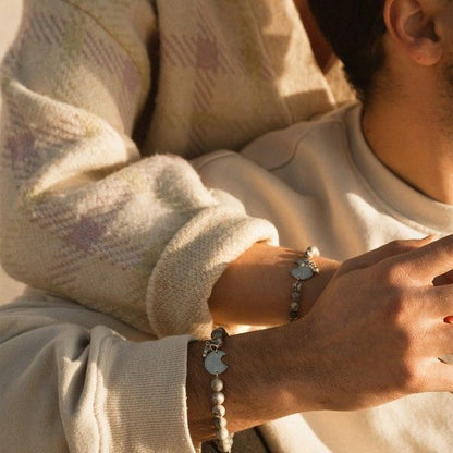 Couple wearing AN JEWELS JEWELRY Mod. ADC.BWGLB02S bracelets showcasing elegant design.