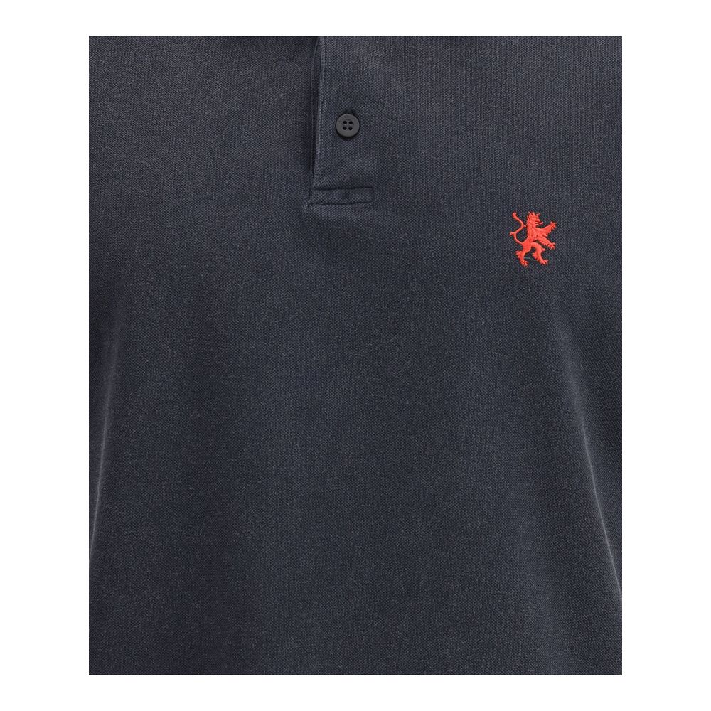 Close-up of Balenciaga Black Cotton Polo Shirt with embroidered logo and button closure.