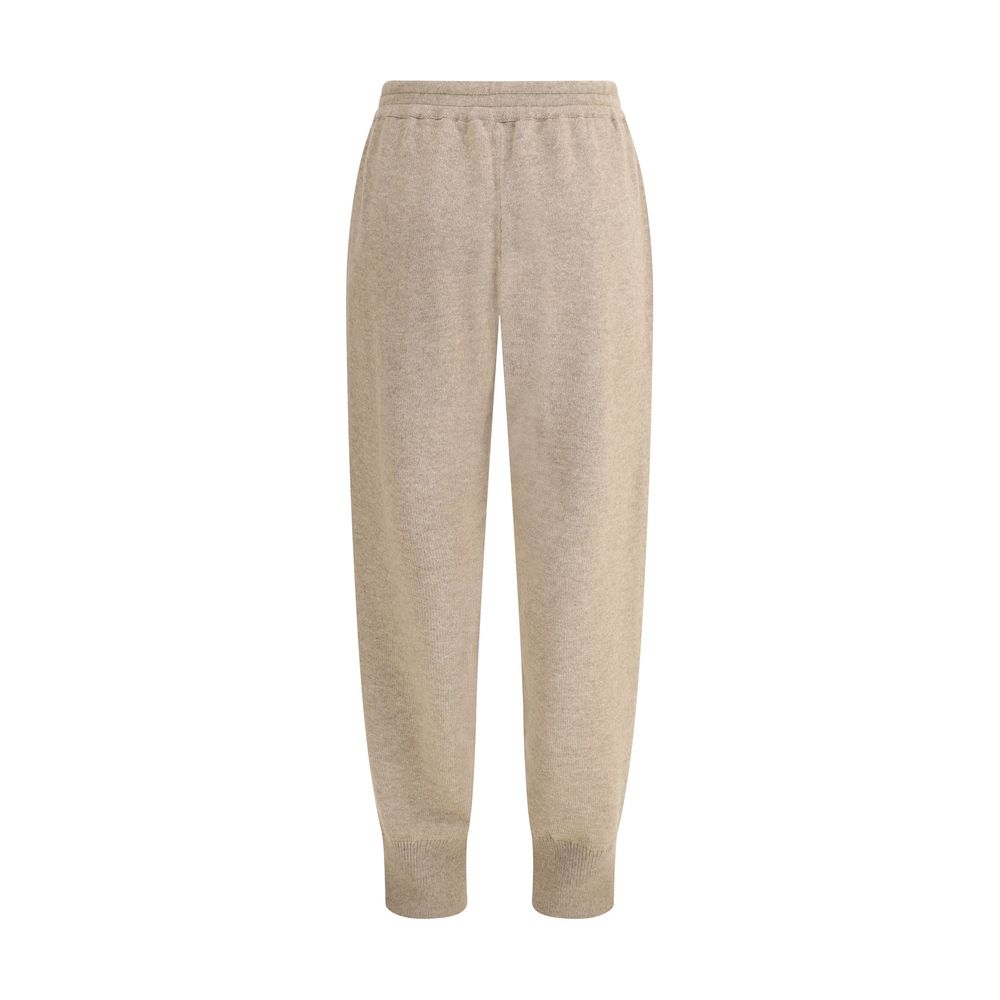 Brunello Cucinelli Beige Cashmere Pants with elastic waistband, side pockets, and tapered bottom for a stylish and comfortable fit.
