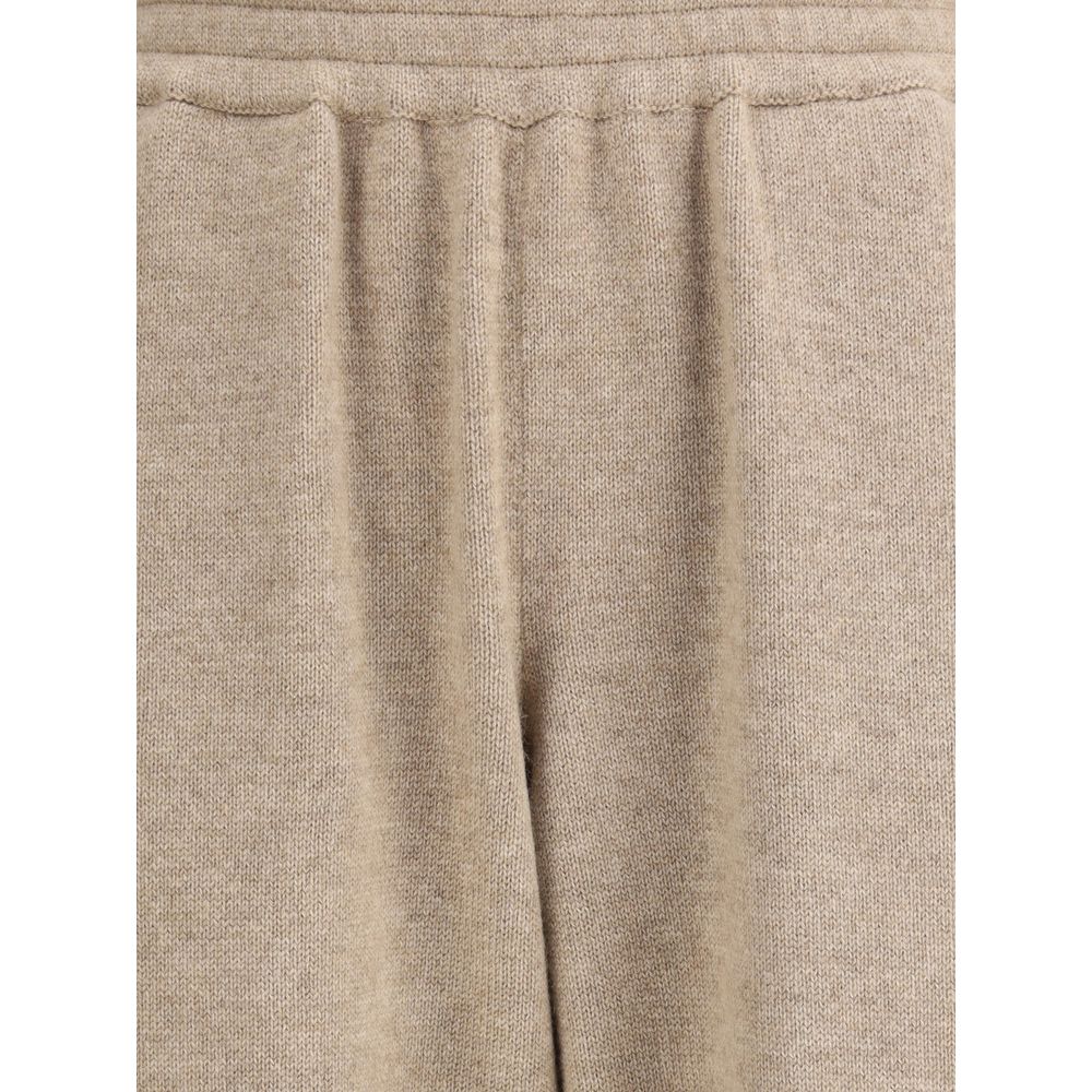 Close-up of Brunello Cucinelli Beige Cashmere Pants with elastic waistband and tapered silhouette for elegant casual wear.