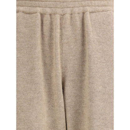 Close-up of Brunello Cucinelli Beige Cashmere Pants with elastic waistband and tapered silhouette for elegant casual wear.