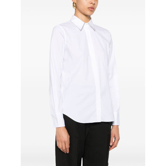 Model wearing Brunello Cucinelli Shirts White, featuring poplin texture and pointed collar.