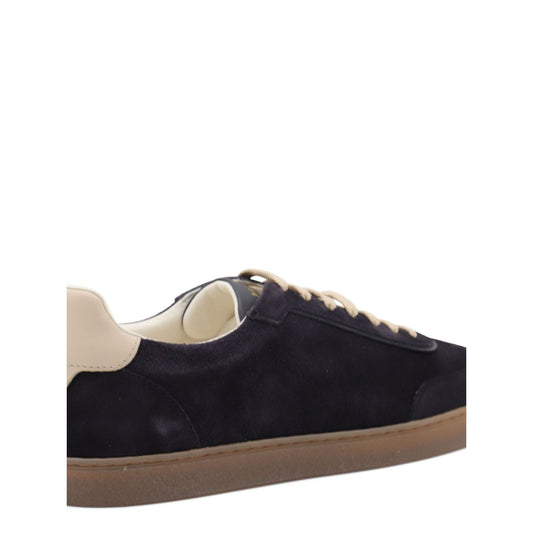 Brunello Cucinelli Suede sneakers in dark blue with leather detail, flat laces, round toe, and rubber sole.