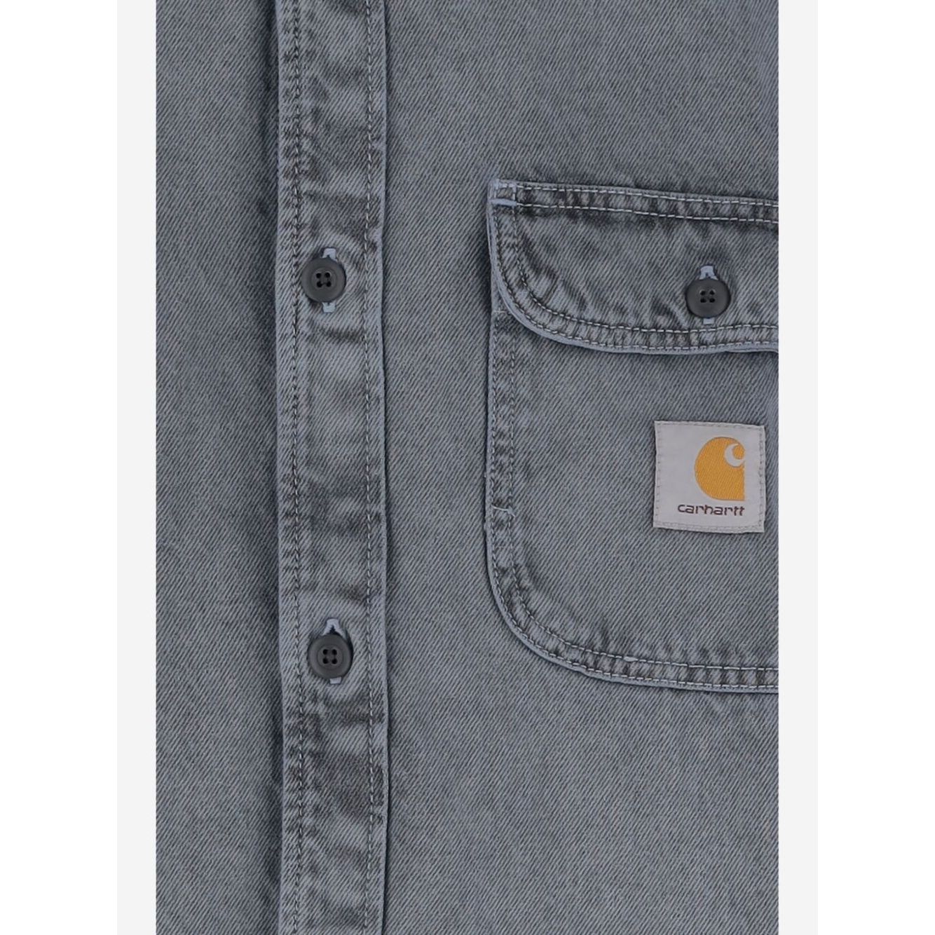 Close-up of CARHARTT WIP PRE Shirts Clear Blue with buttons and pocket detail in silk and nylon tigan denim cotton.