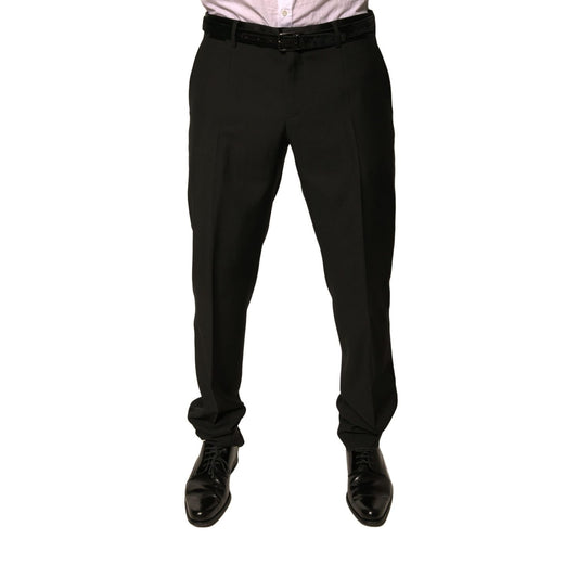 Man wearing Dolce & Gabbana Black Wool Tapered Formal Dress Pants with button and zipper closure, mid waist design, made in Italy.