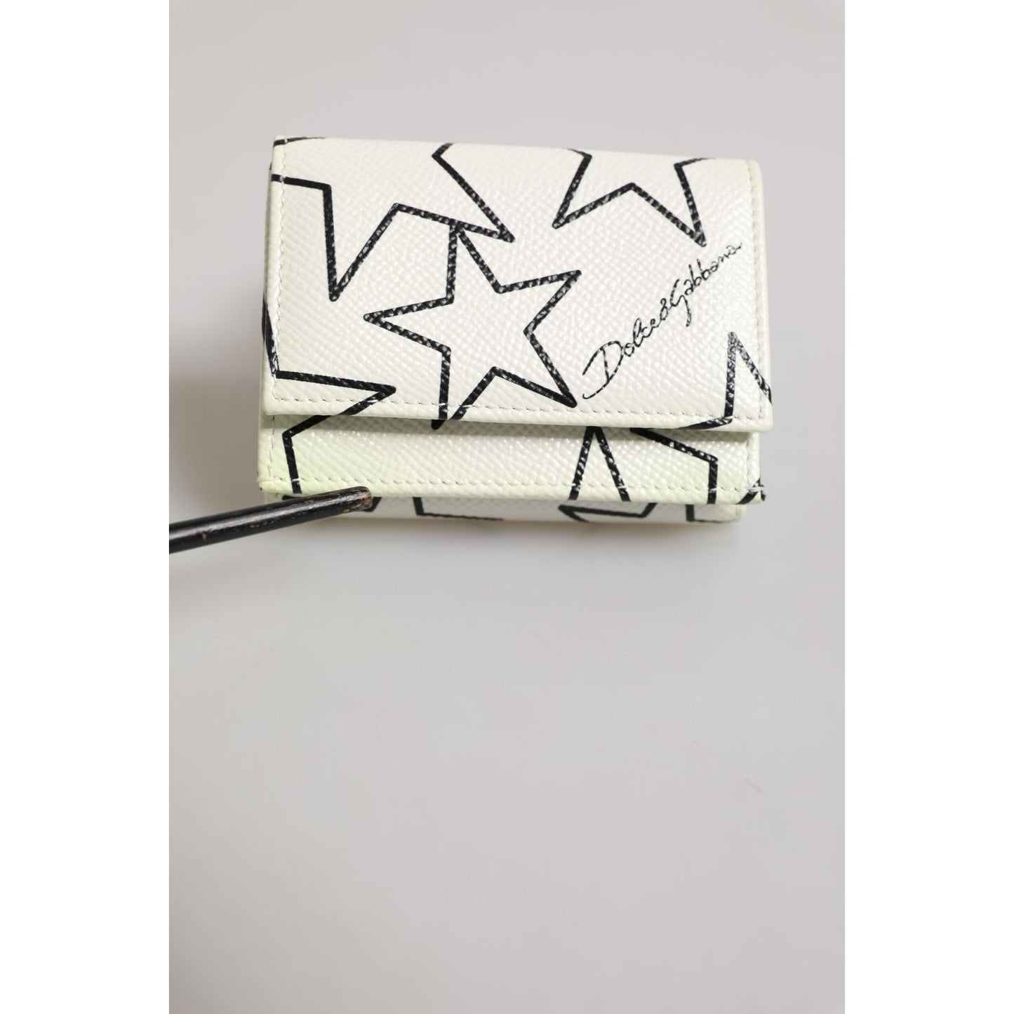 Dolce & Gabbana White Leather Trifold DG Star Print Card Holder Wallet on a light background