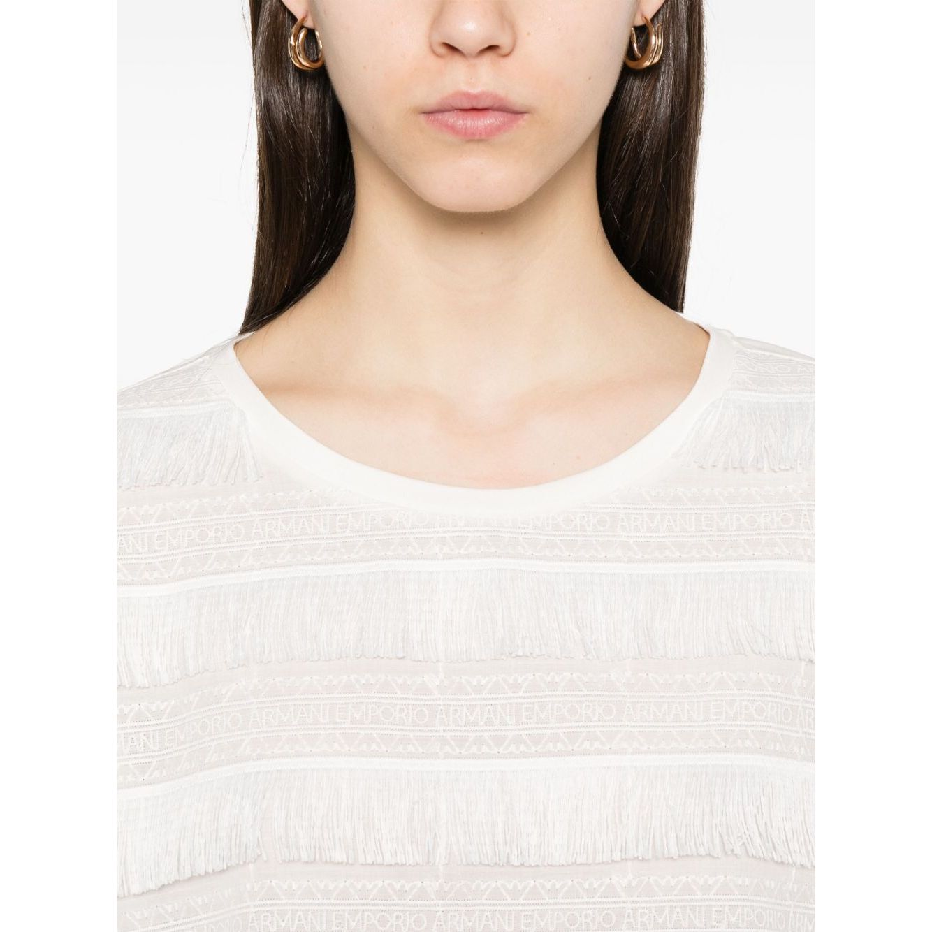 Model wearing Emporio Armani T-shirt with fringes, cotton crew neck, short sleeves, embroidered logo, true to size fit.