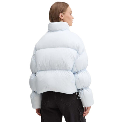 Moose Knuckles Light Blue Nylon Women Jacket with down padding, showcased from the back view, highlighting style and drawstring details.