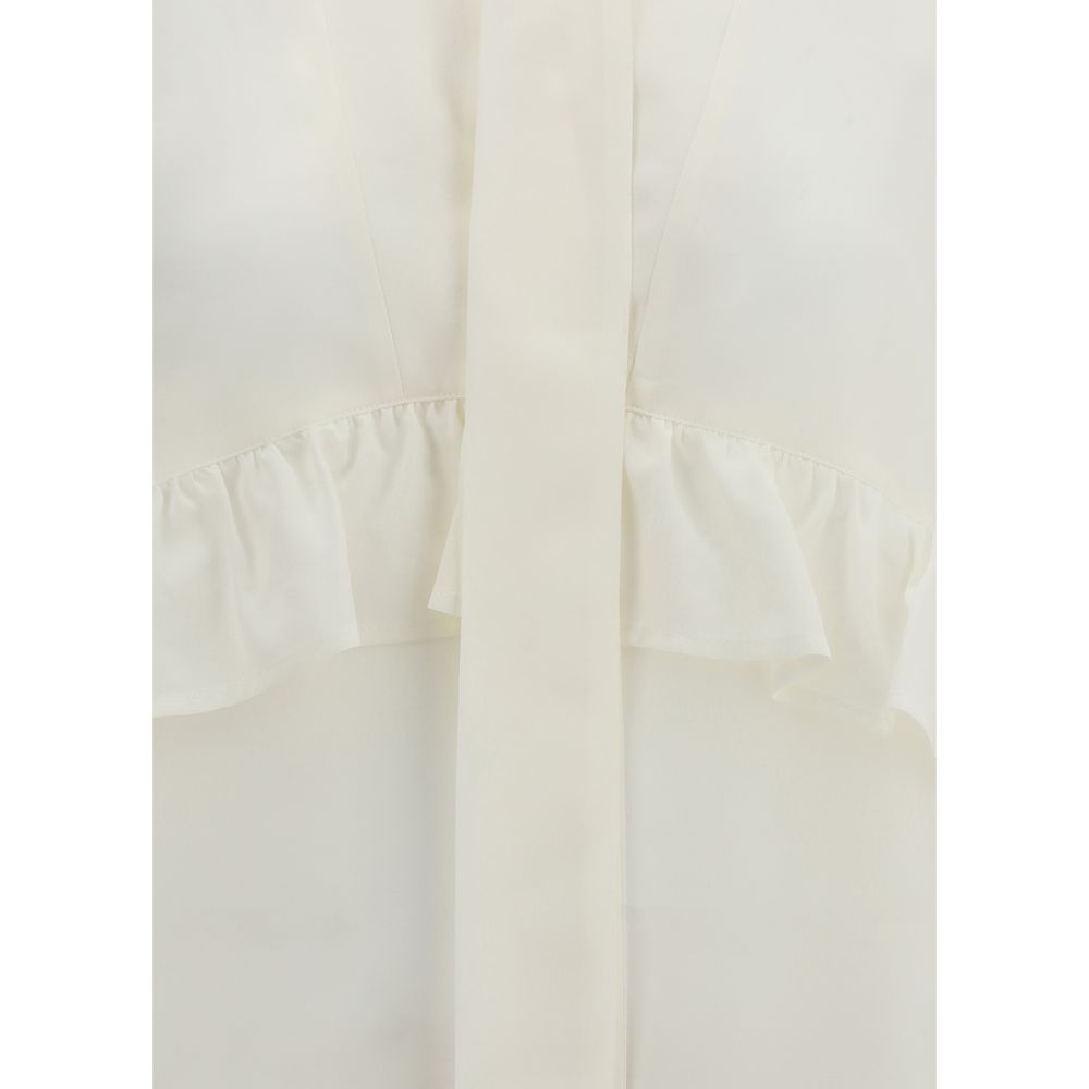 P.A.R.O.S.H. Cream Silk Blouse with V-neck, ruffles, and bow closure, showcasing elegant design and 100% silk composition.
