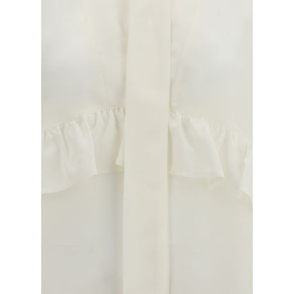 P.A.R.O.S.H. Cream Silk Blouse with V-neck, ruffles, and bow closure, showcasing elegant design and 100% silk composition.