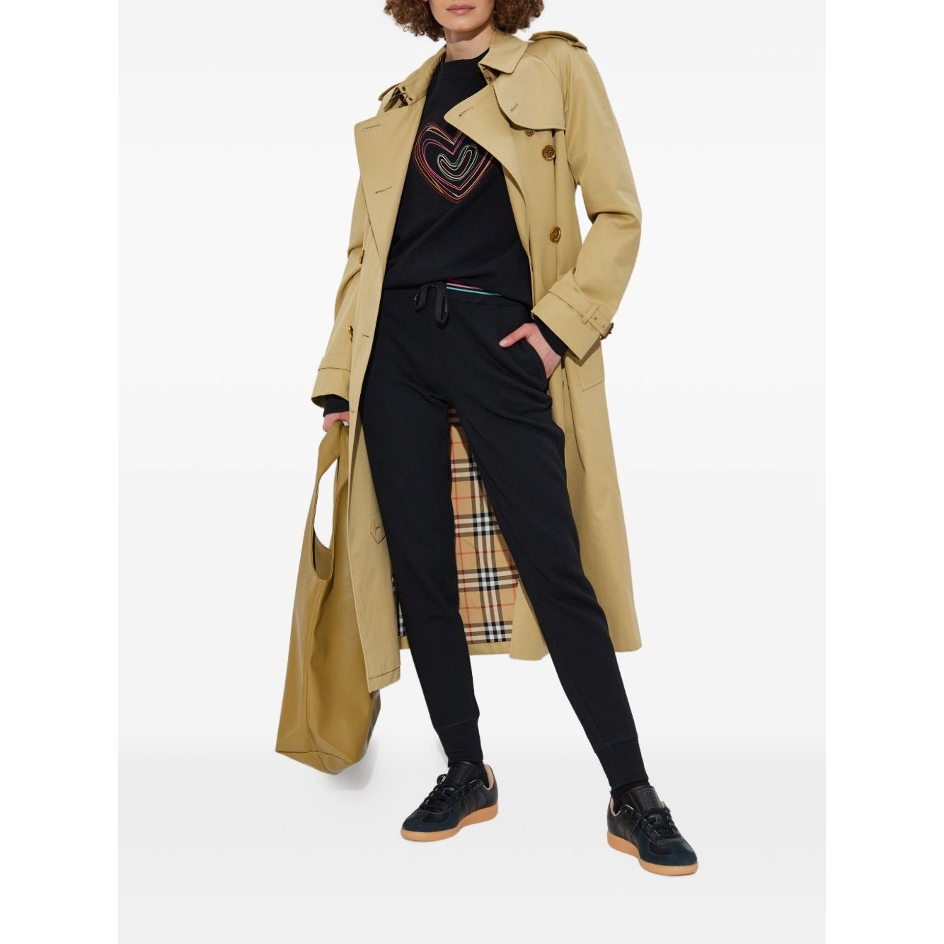 PS By Paul Smith Sweaters Black with heart embroidery, ribbed neckline, and relaxed fit, shown with trench coat and casual pants outfit.