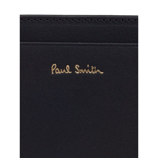 Paul Smith Signature Stripe leather card case with black card slots and logo stamp on front, showcasing elegant design.