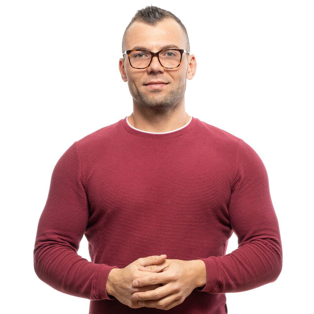 Man wearing Sandro Brown Men Glasses Frame with full-rim and plastic material, featuring trapezium style lenses and brown color.