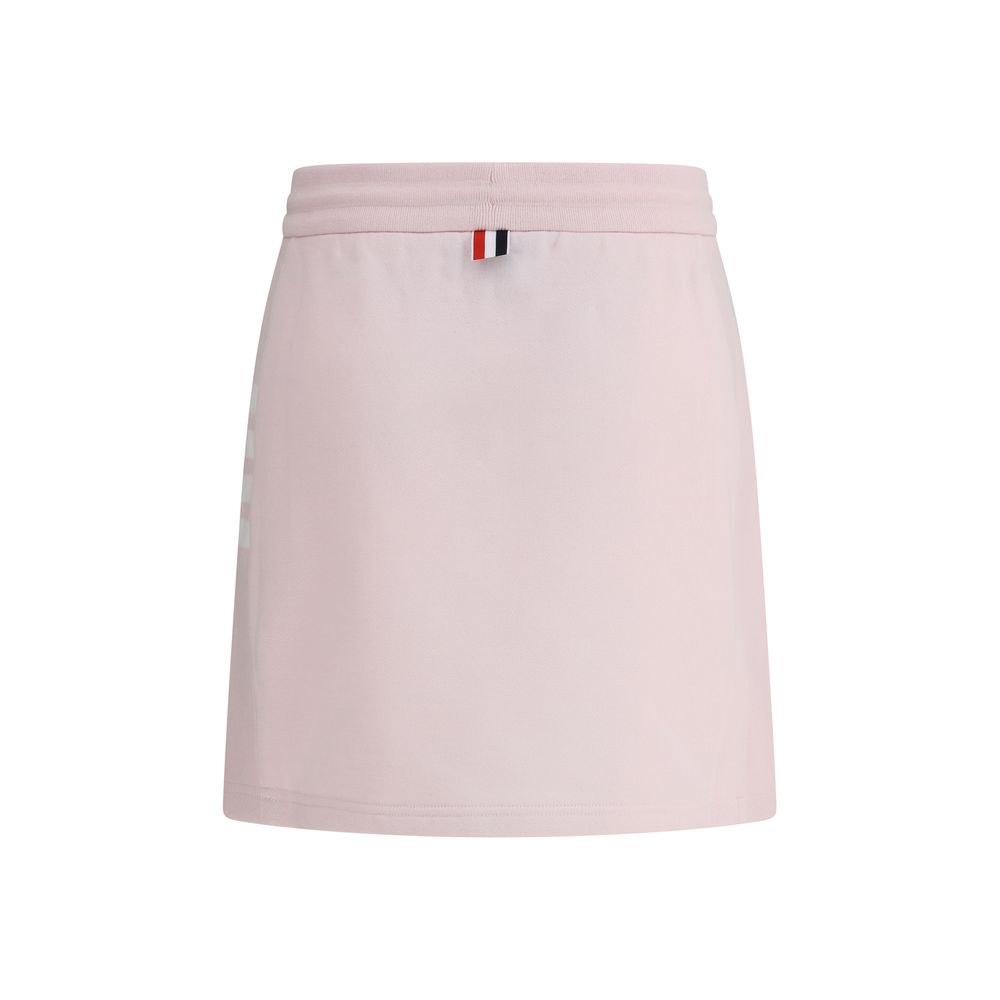 Thom Browne Multicolor Cotton Mini Skirt with adjustable drawstring and logo patch, featuring front slits and iconic side bands.