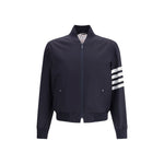 Thom Browne Wool Jacket with ribbed collar, front zipper, pockets, ribbed cuffs, and signature horizontal arm band.