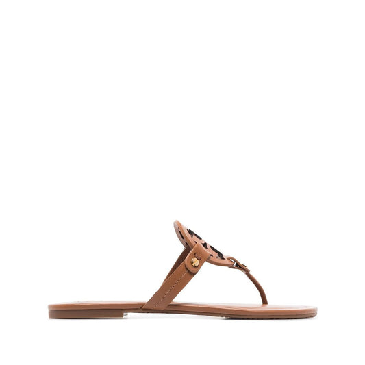 Brown Tory Burch Miller Sandals with laser-cut Double T logo, branded insole, and flat rubber sole.